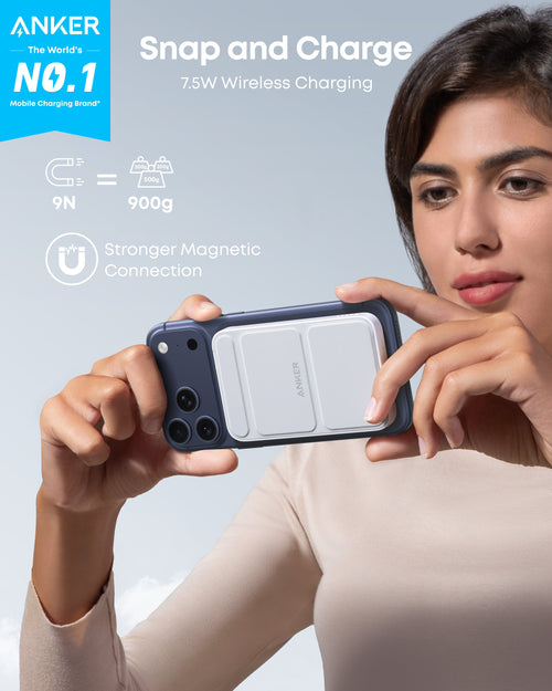 Person holding a smartphone with a wireless charging case, featuring Anker branding and text about wireless charging capabilities.