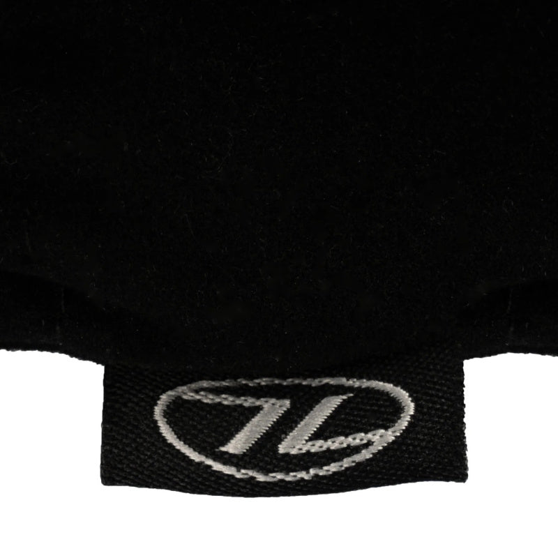 Close-up of a black garment with a logo on a white background