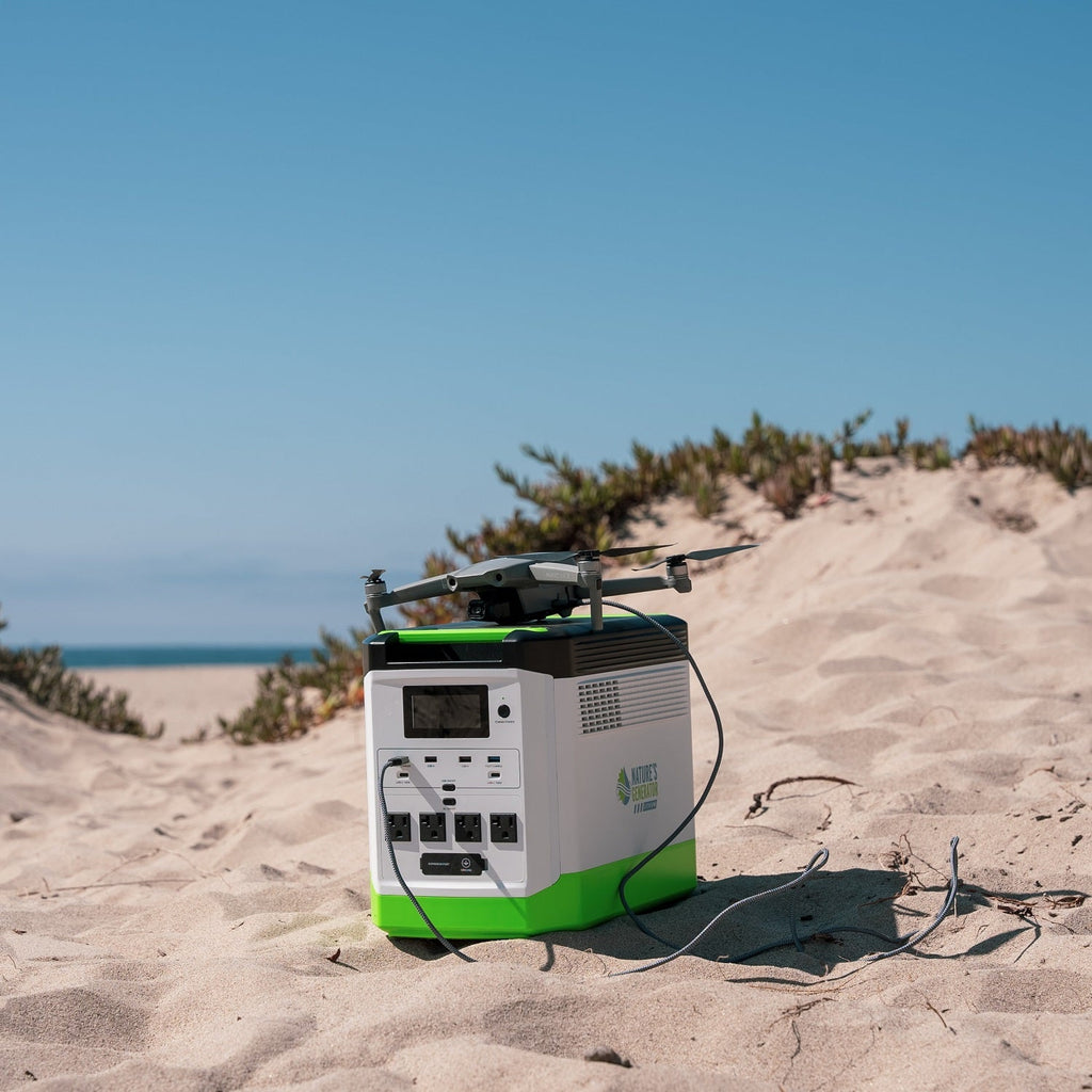 Portable power station with a drone on a sandy beach