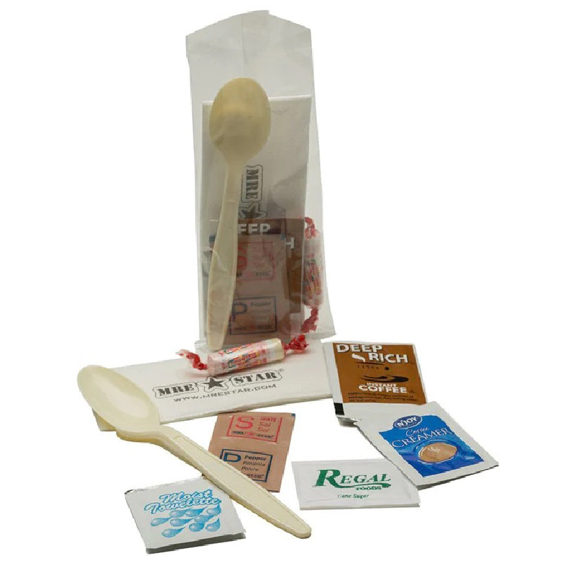Wooden spoon and packets of coffee and tea on a white background