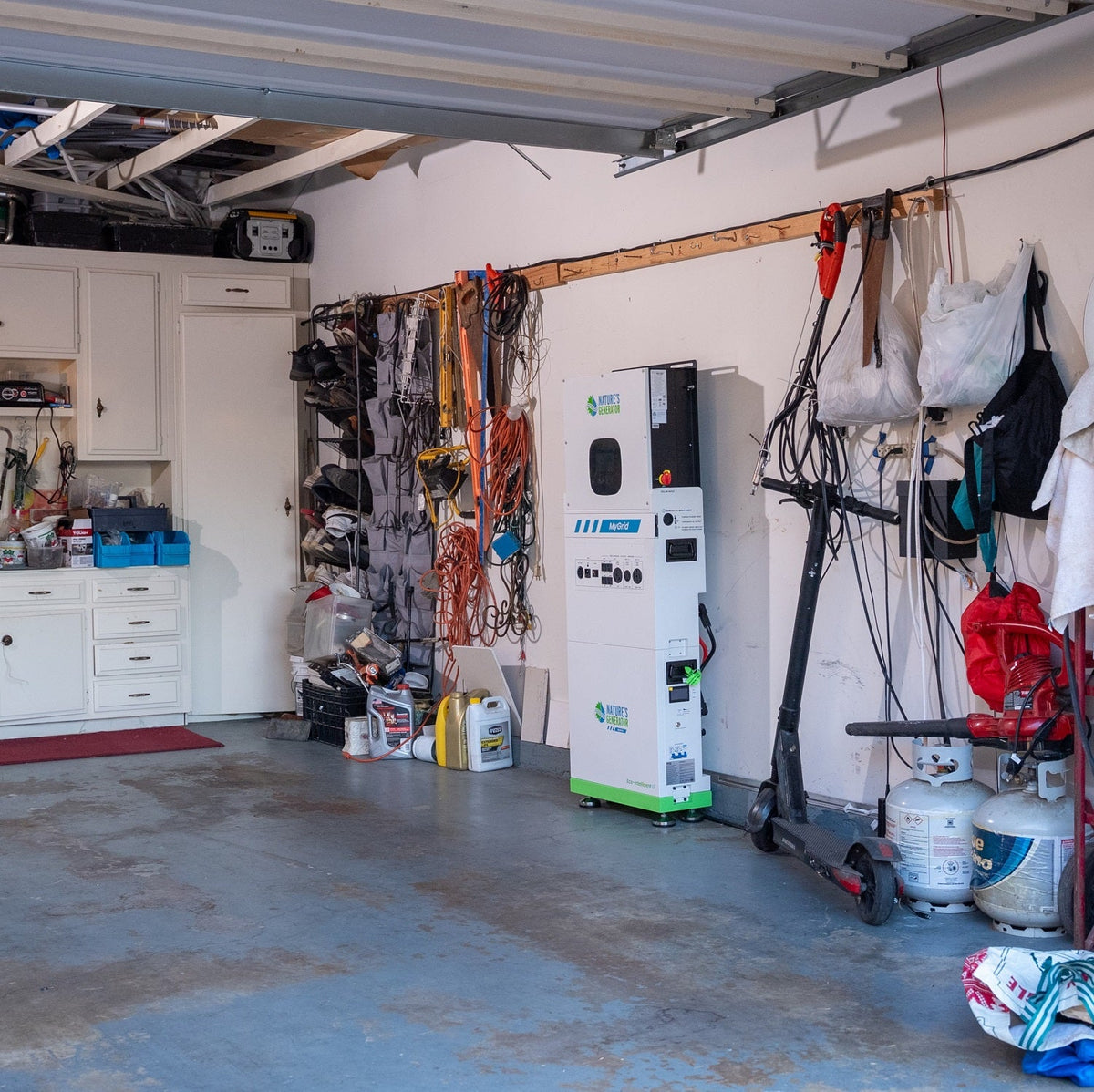 Garage with tools, equipment, and a charging station.