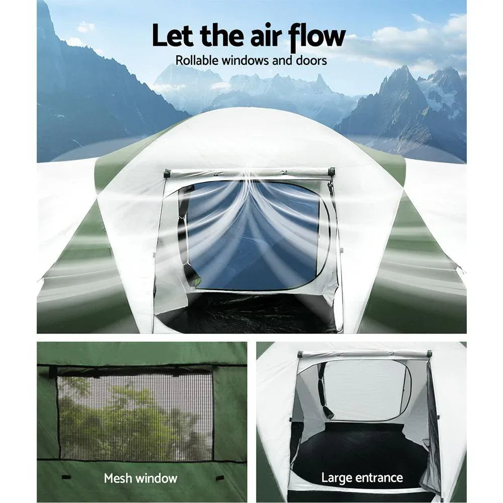 Camping tent with rollable windows and doors, set against a mountainous landscape.