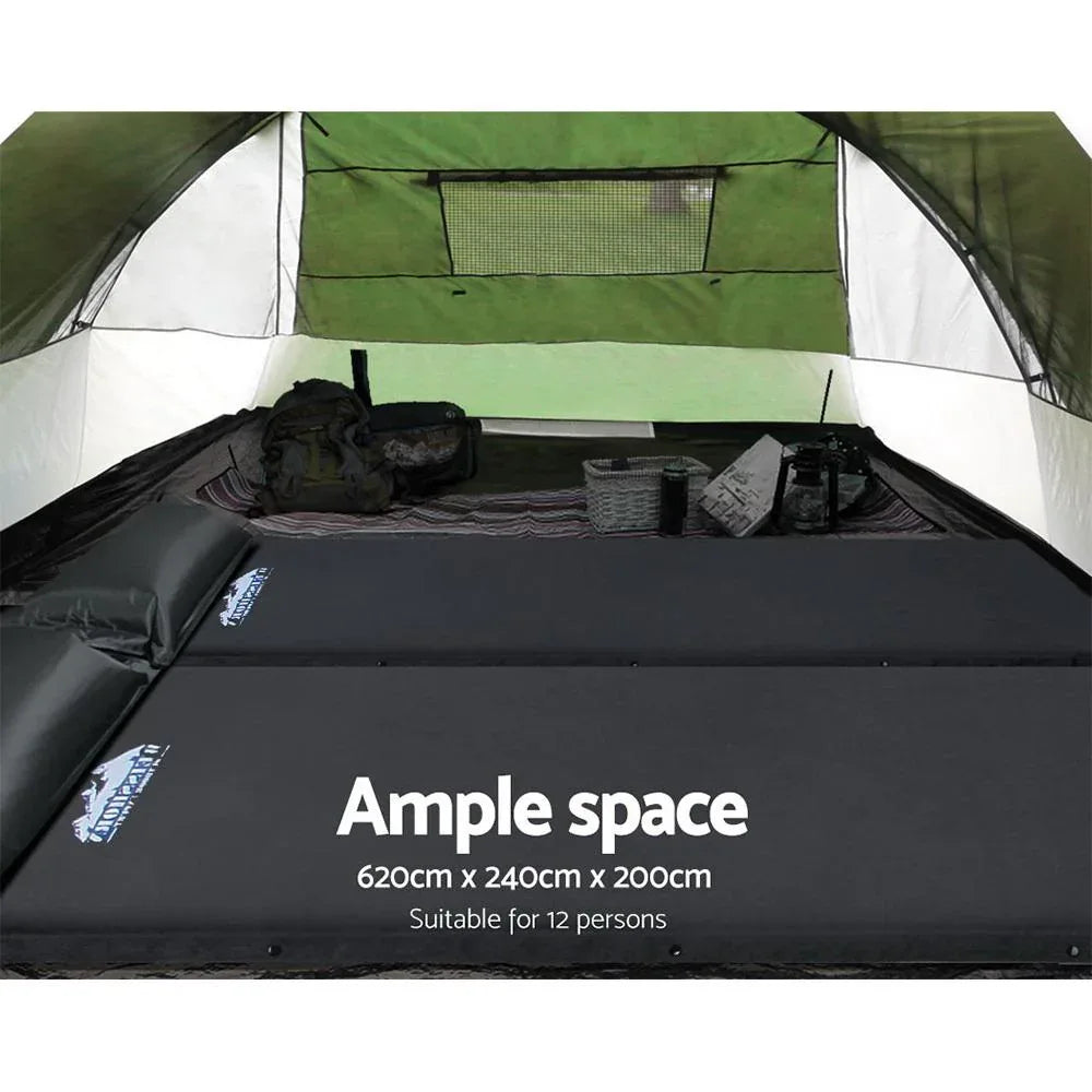 Camping tent interior with sleeping pads and bags, showing ample space for 12 people.