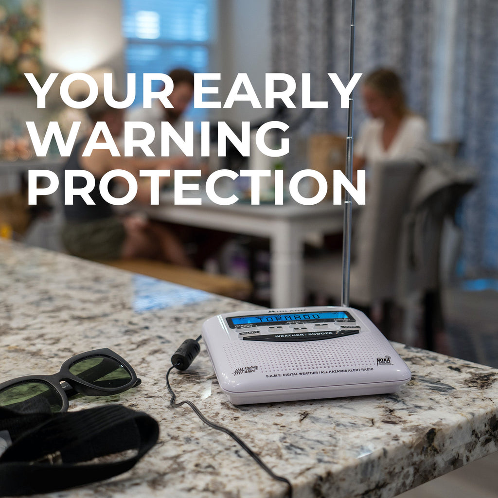 Radio on a kitchen counter with text 'Your Early Warning Protection' and people in the background.