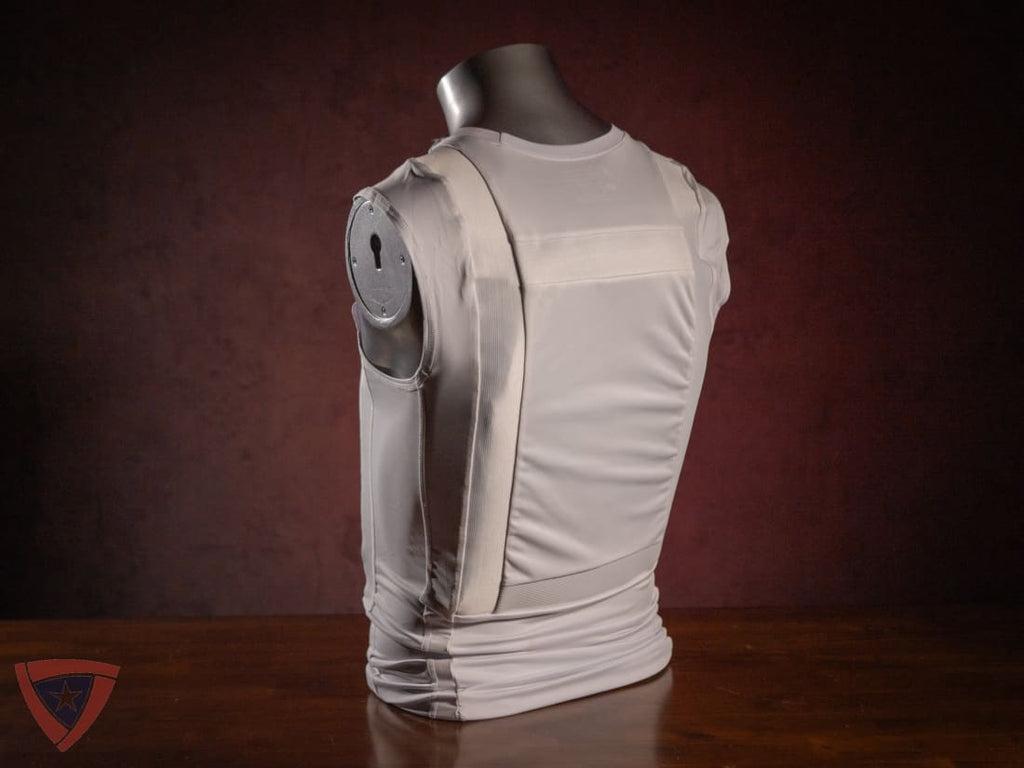 Mannequin wearing a beige tactical vest against a dark background