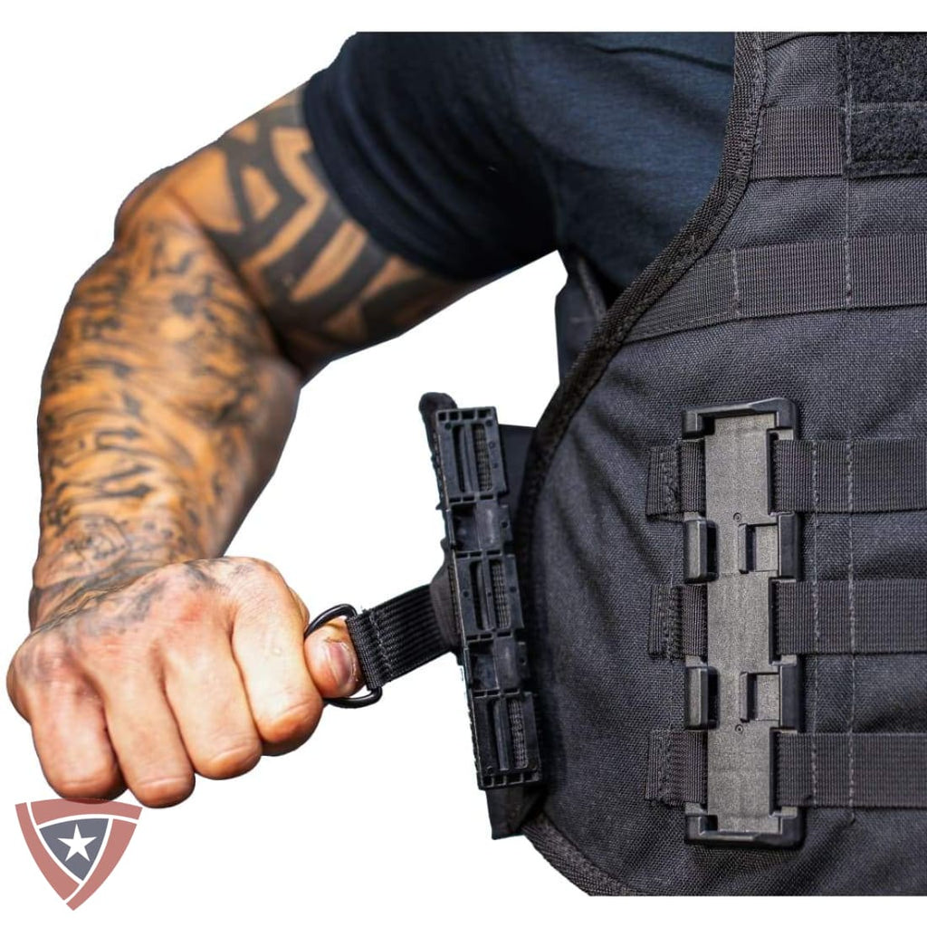 Person wearing a tactical vest with a visible brand logo on a white background
