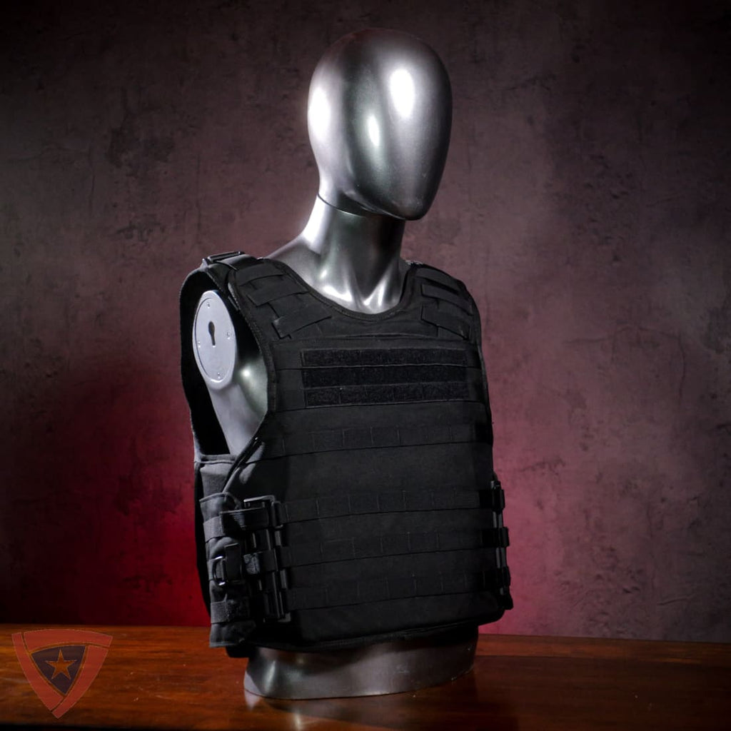 Black tactical vest on a mannequin against a dark background