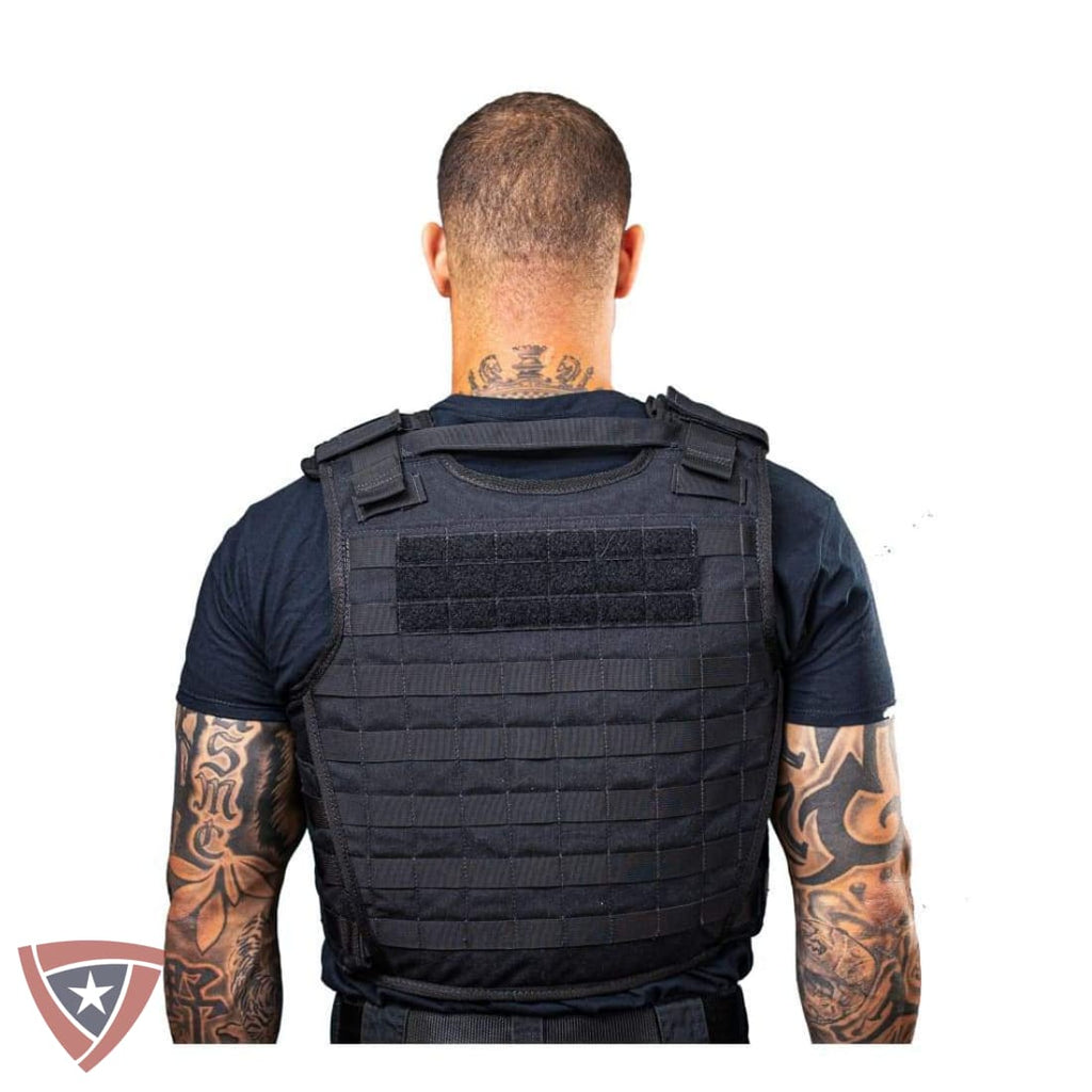 Person wearing a black tactical vest on a white background