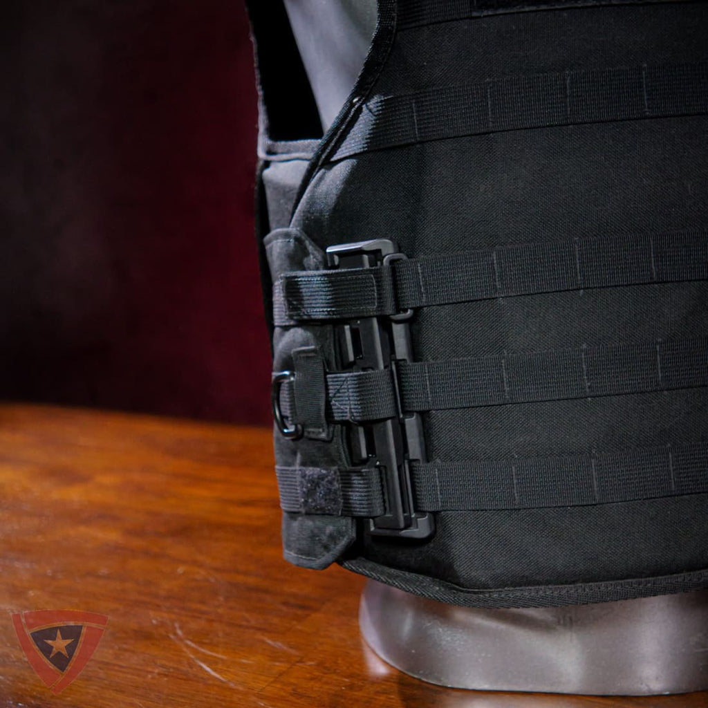 Black tactical vest on a mannequin with a wooden surface background