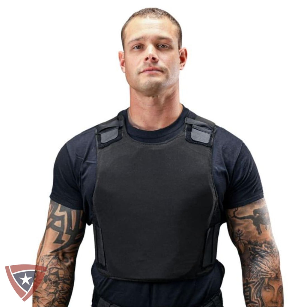 Man wearing a black protective vest on a white background