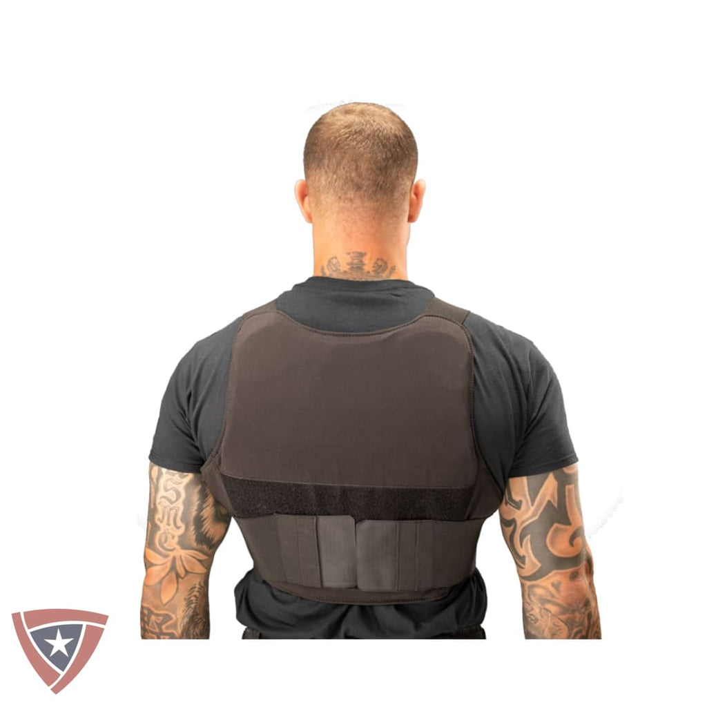 Man wearing a black tactical vest on a white background