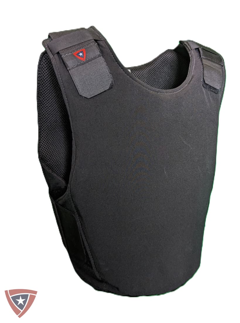 A black tactical vest or armor plate shown on a plain white background, with mesh side panels and a small red-and-white logo patch near the shoulder.