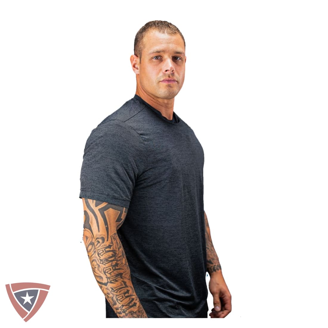 A man with tattoos wearing a dark gray heathered short-sleeve athletic t-shirt, shown from the waist up against a solid white background.