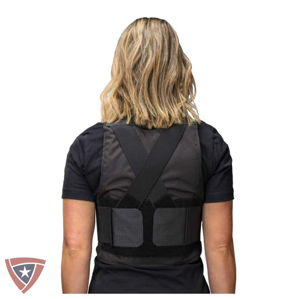 Person wearing a black tactical vest on a white background
