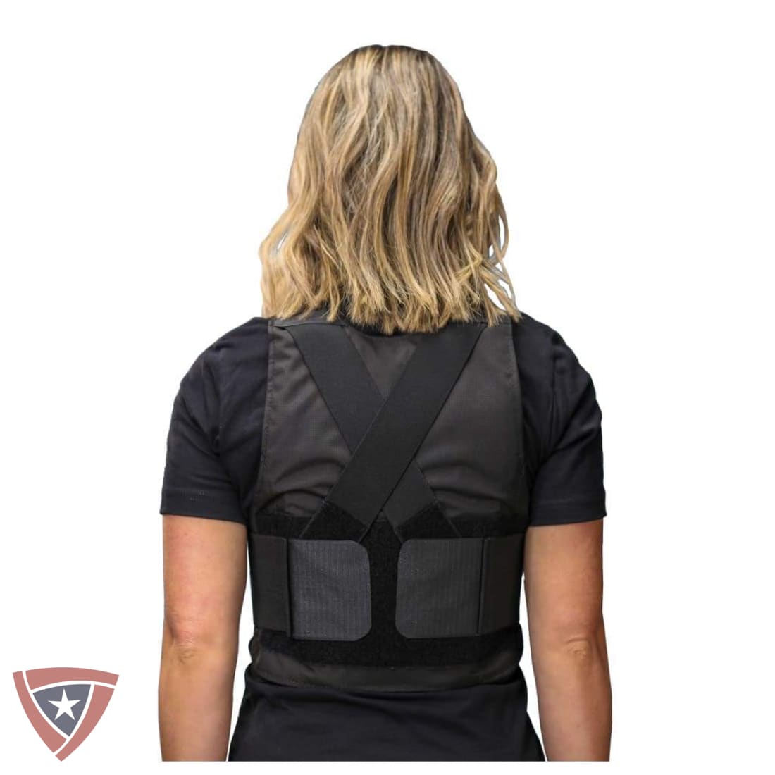 Person wearing a black tactical vest on a white background