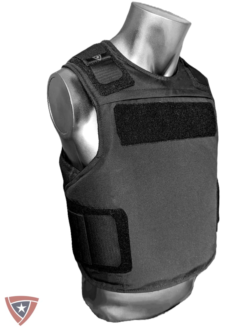 A black tactical vest displayed on a metallic mannequin torso against a plain white background.