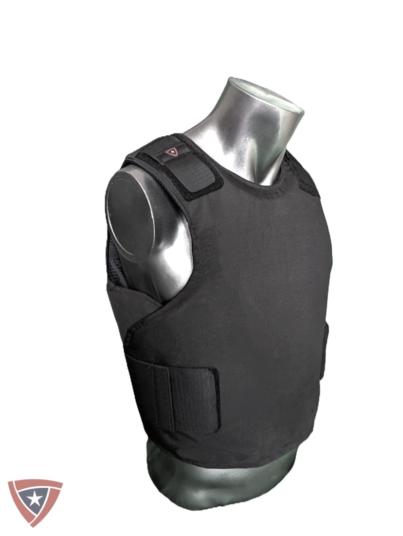 A black tactical vest or body armor plate displayed on a metallic mannequin torso against a plain white background.