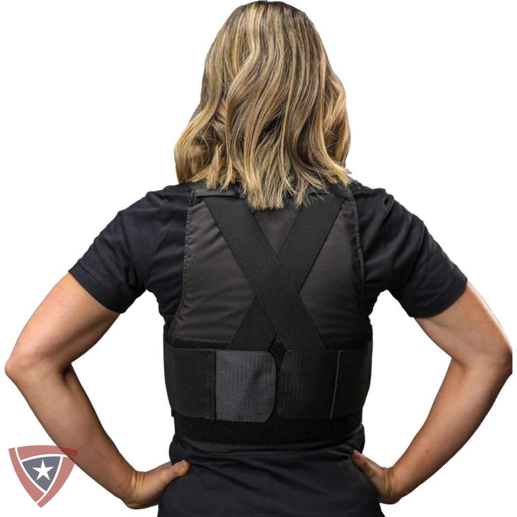 Person wearing a black back brace against a white background