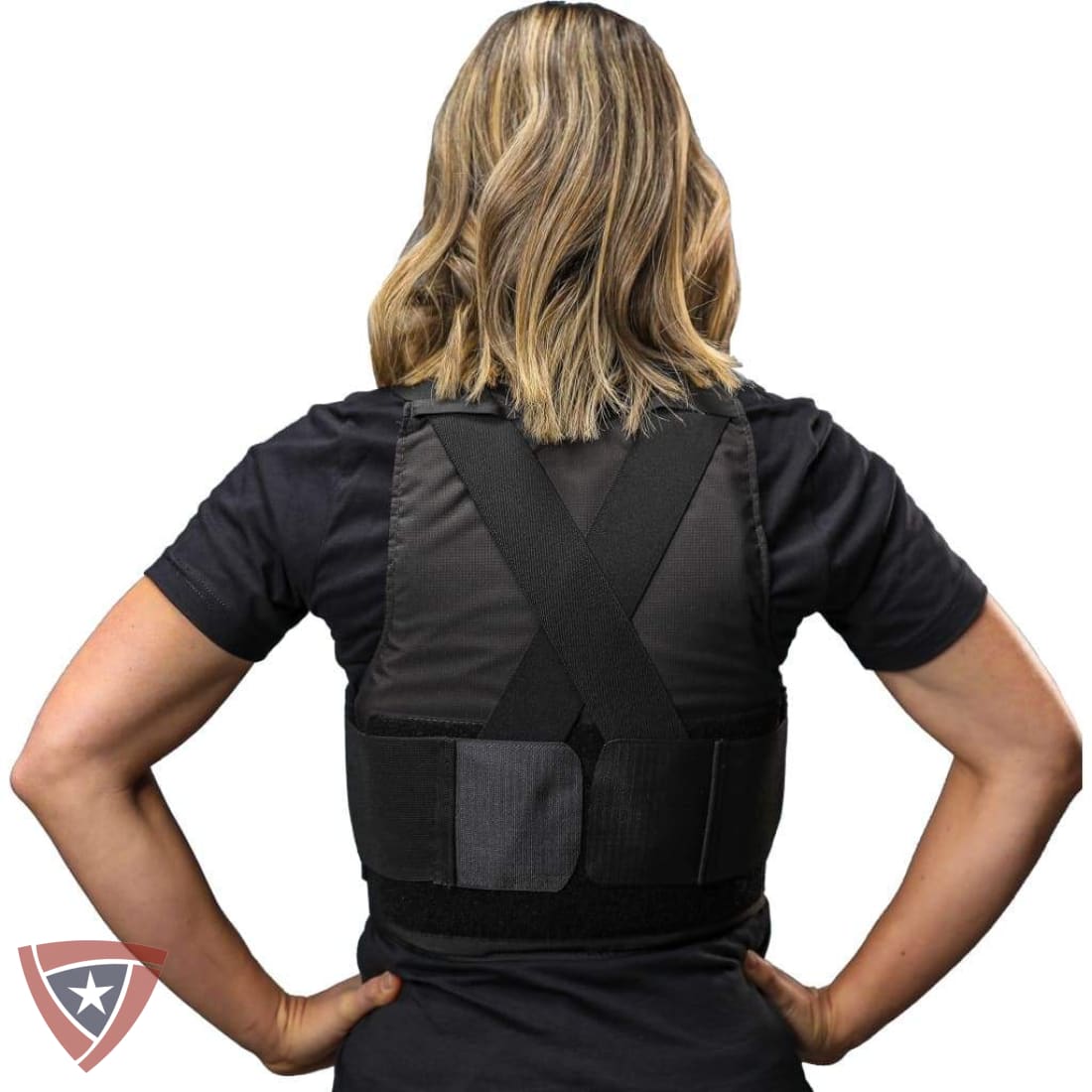 Person wearing a black back brace against a white background