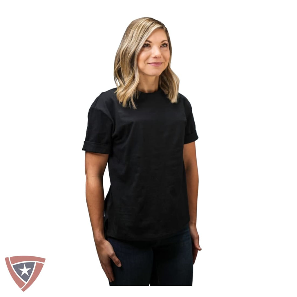 Woman wearing a black t-shirt on a white background with a visible brand logo.
