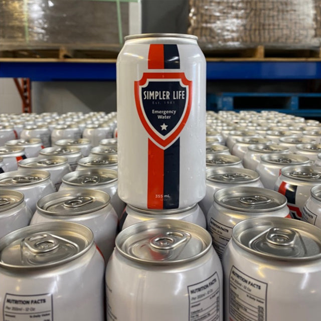 Simpler Life emergency water can among stacked cans in a warehouse setting