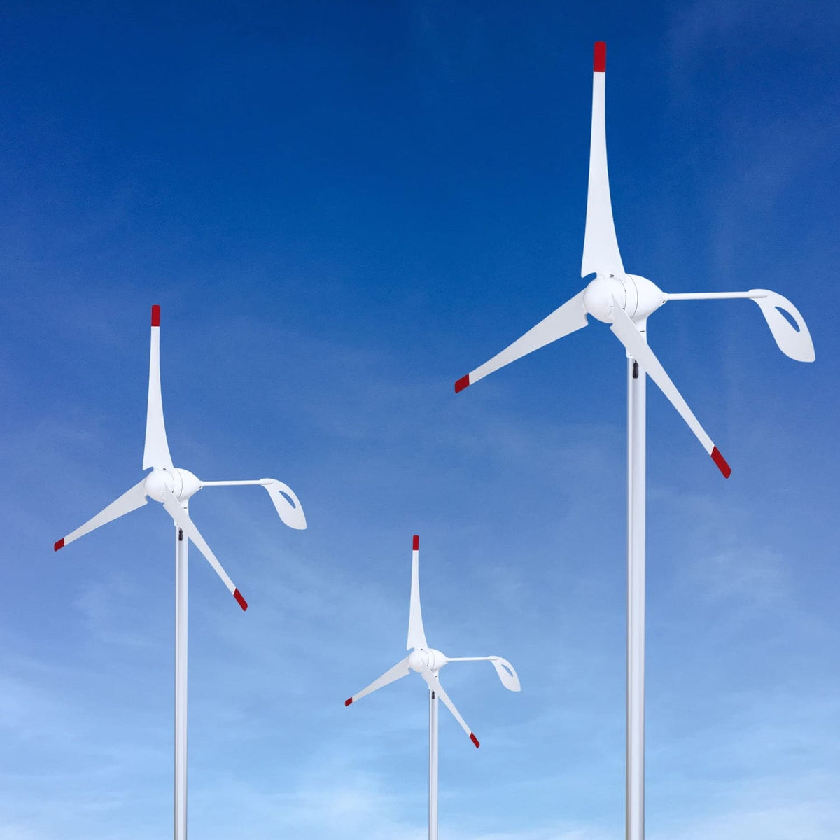 Three wind turbines against a clear blue sky